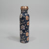 Decorative water bottle with floral design on a tiled floor
