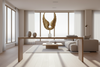 Gold winged sculpture on a white base against a gray background